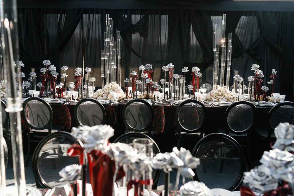 wedding reception, wedding design, tented wedding, black wedding, red wedding, halloween wedding, luxe valentines day party, candelabras, silver roses, black chairs, black tent draping, luxury wedding planning and design, tablescape