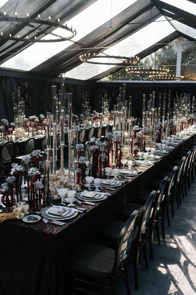 wedding reception, wedding design, tented wedding, black wedding, red wedding, halloween wedding, luxe valentines day party, candelabras, silver roses, black chairs, black tent draping, luxury wedding planning and design, tablescape