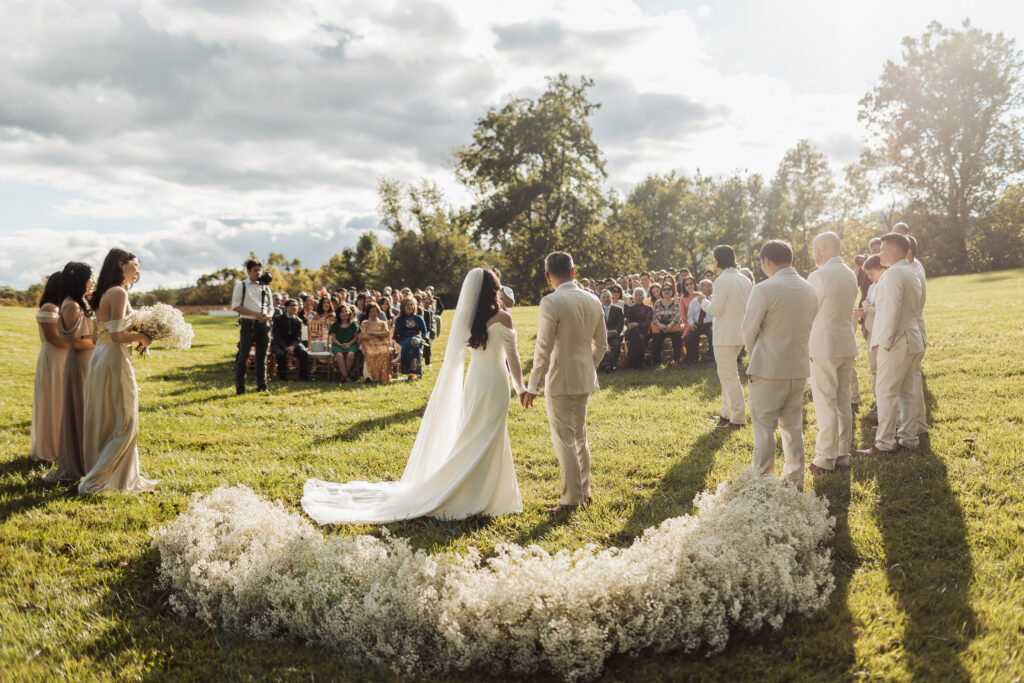 monte ventoso wedding, luxurious italian villa wedding venue, virginia wedding planner and designer, luxury wedding, bridal dress, wedding veil, sleeved wedding dress, bride and groom, ceremony grounded floral arch, baby's breath floral arch, outdoor wedding ceremony