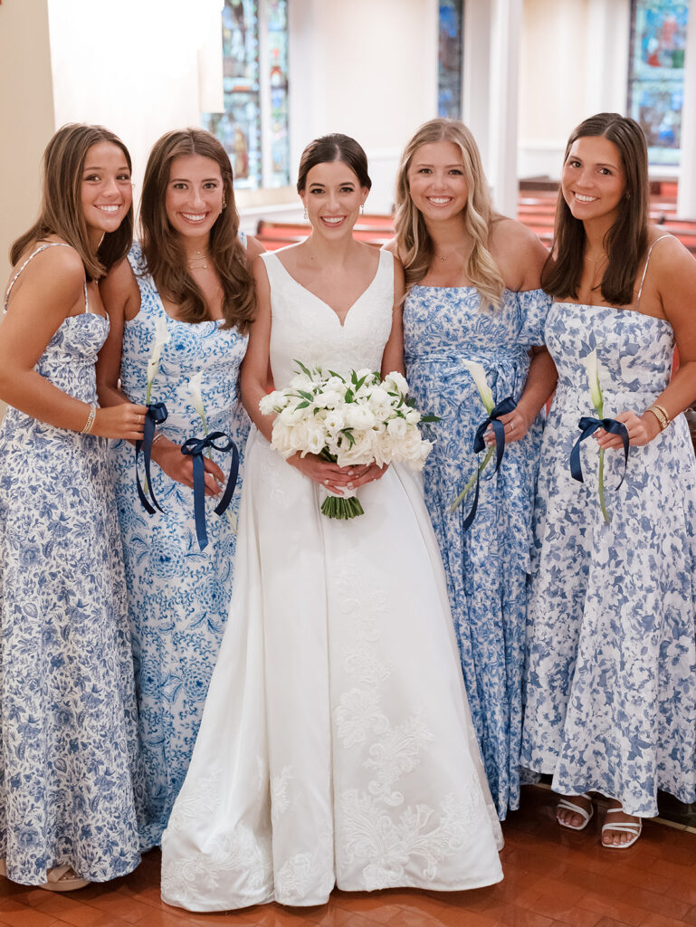 St John's Episcopal Church wedding, bride and bridesmaids, bridal dress, white bridal bouquet, blue patterned bridesmaids dresses