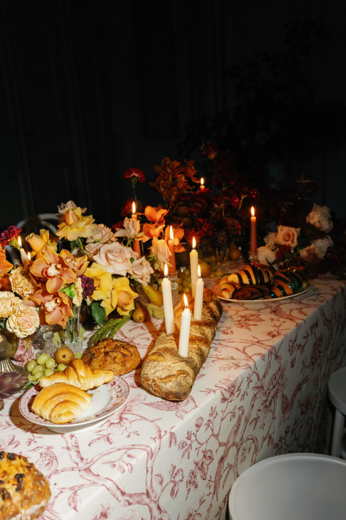 france wedding venue, burgundy wedding venue, french castle wedding venue, wedding planning and design, destination planner, france wedding, burgundy france, wedding tablescape, wedding tablescape design, bridal gloves, croissant, colorful croissants, candles in baguette