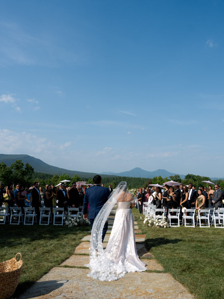 the seclusion wedding, wedding ceremony, ceremony white florals, outdoor wedding, summer wedding, luxury wedding planner, bride, veil