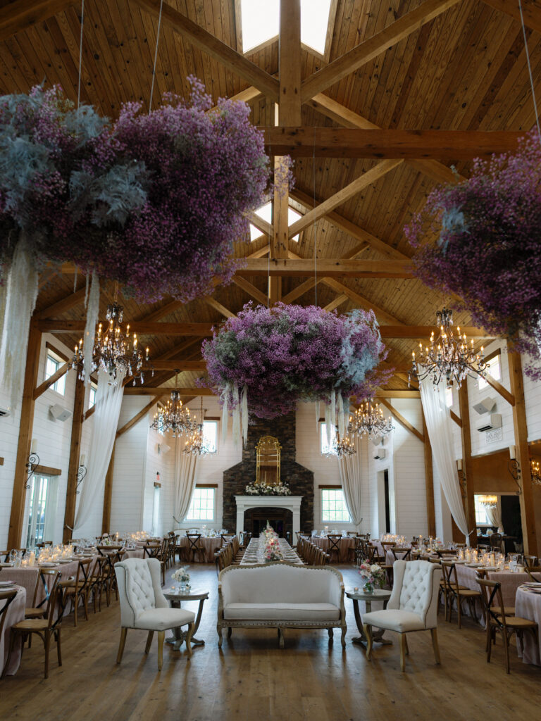 the seclusion wedding, wedding reception, reception white pink flowers, summer wedding, luxury wedding planner, floral ceiling installation, purple wedding flowers