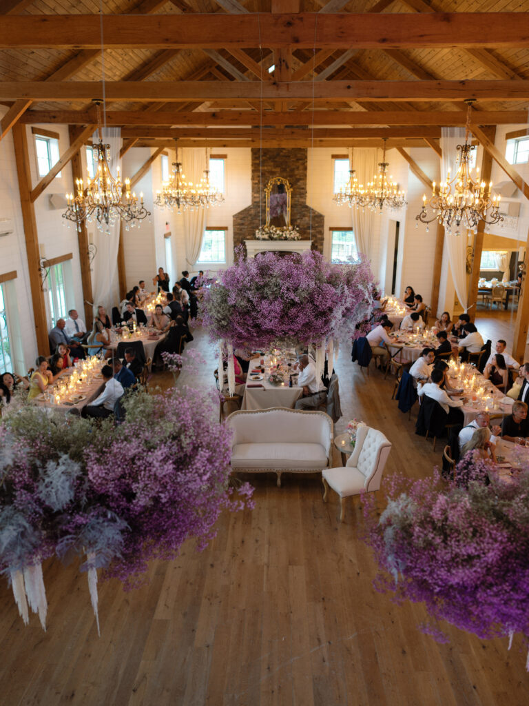 the seclusion wedding, wedding reception, reception white pink flowers, summer wedding, luxury wedding planner, floral ceiling installation, purple wedding flowers