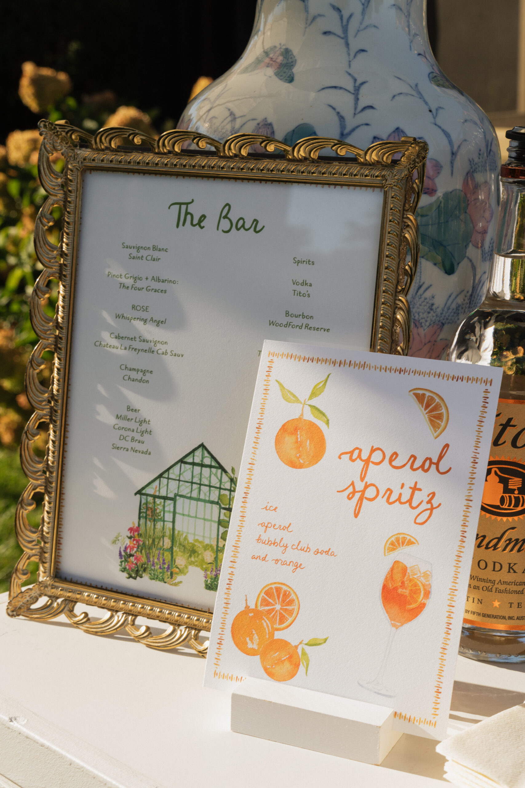 wedding at glenstone virginia, luxury wedding planner and designer, luxury tented wedding, fairtytale wedding, whimsical wedding, dmv wedding planner and designer, aperol spritz sign, wedding bar sign, wedding cocktail hour