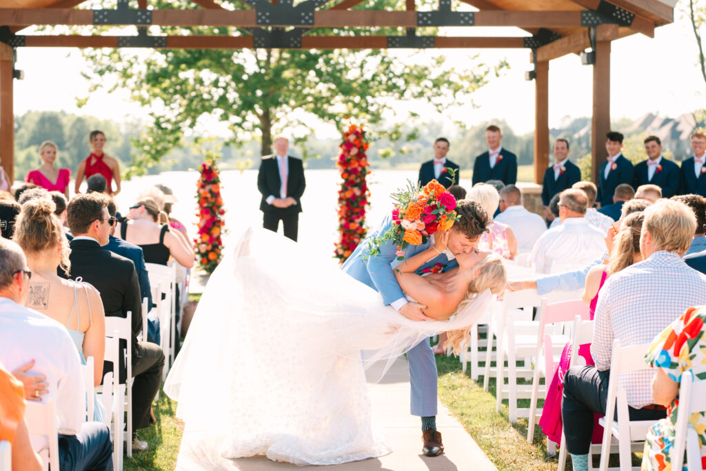 washington dc wedding planner, dmv wedding planner, destination wedding planner, indiana wedding planner, wedding flower arch, wedding ceremony altar, colorful wedding, bride and groom, colorful bridal bouquet, light blue groom suit, wedding ceremony