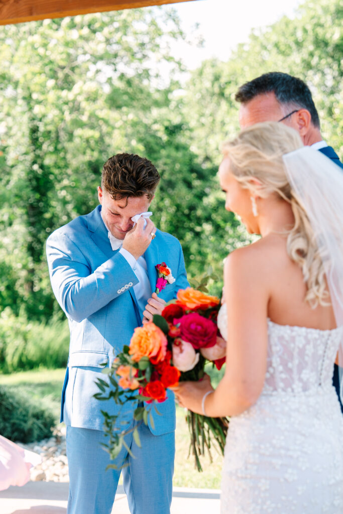 washington dc wedding planner, dmv wedding planner, destination wedding planner, indiana wedding planner, bride and groom first look at the altar, bride and groom, colorful bridal bouquet, light blue groom suit, wedding ceremony