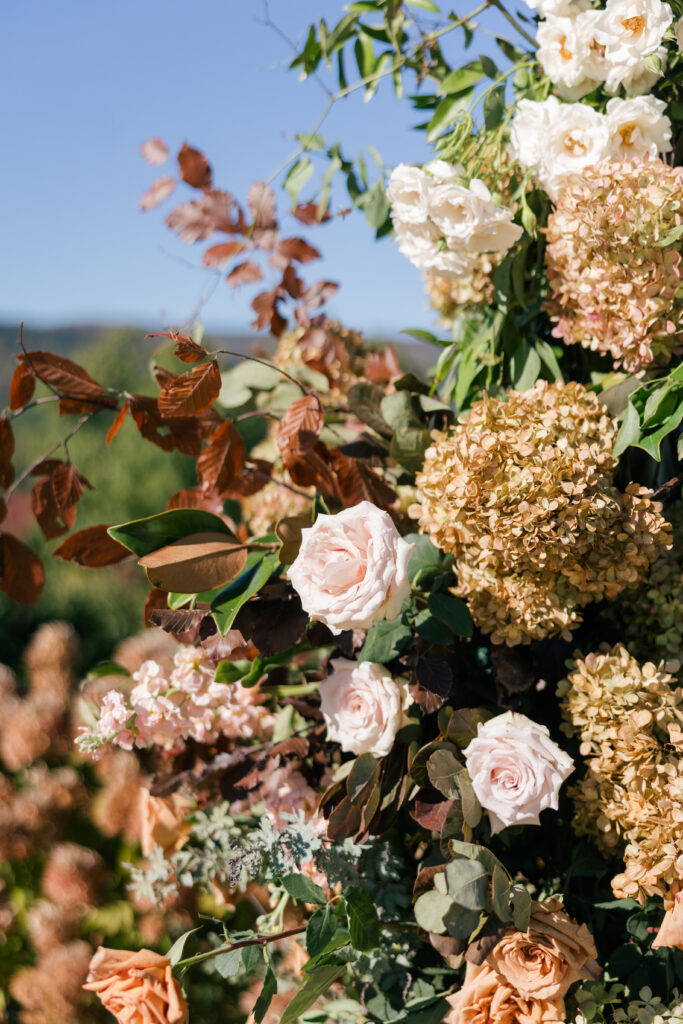 the seclusion wedding, fall wedding, ceremony, ceremony flower arch, fall wedding flowers