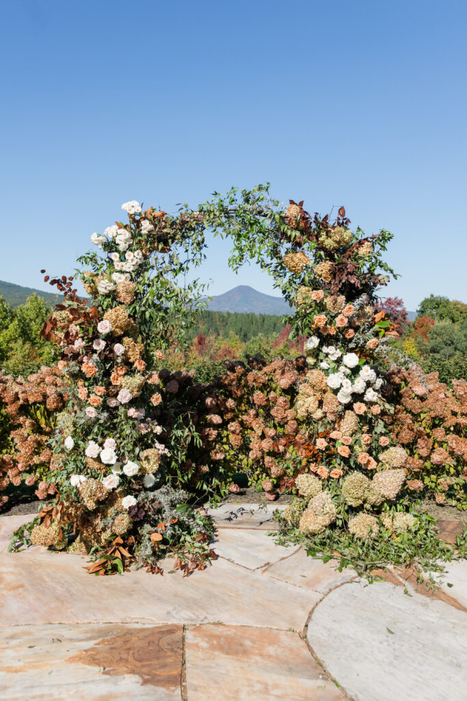 the seclusion wedding, fall wedding, ceremony, ceremony flower arch, fall wedding flowers, altar decor