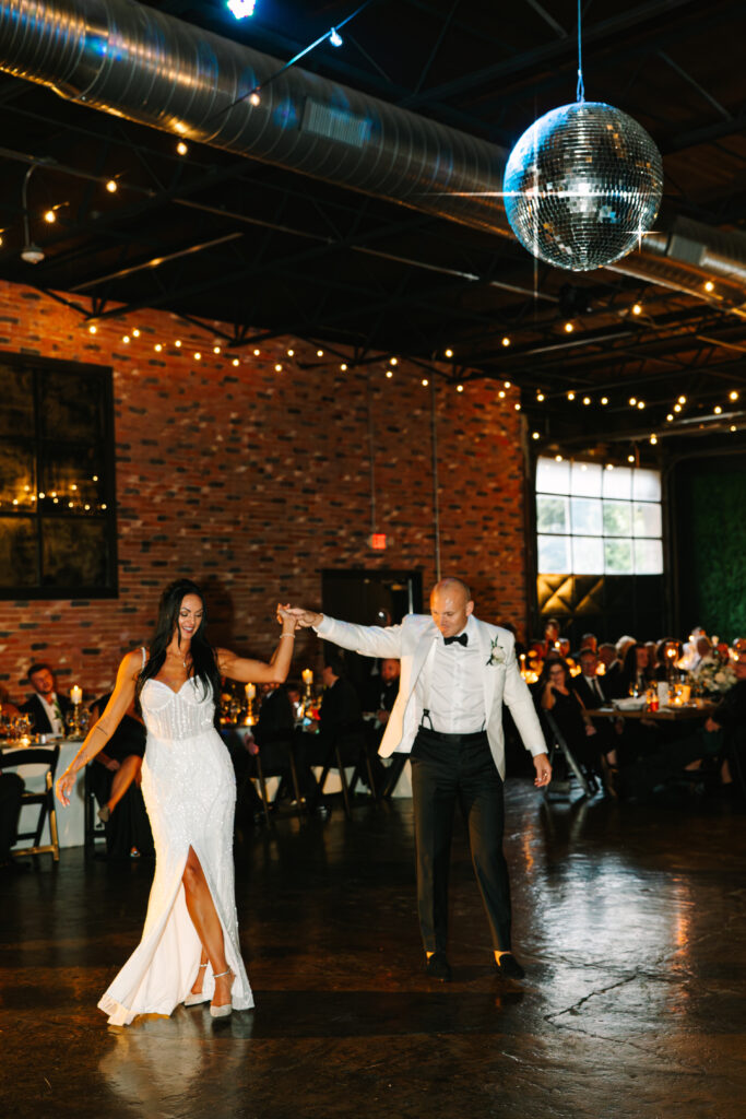 wedding reception, Wedding at the Evansville Museum of Arts, Indiana wedding, wedding disco ball, bride and groom first dance