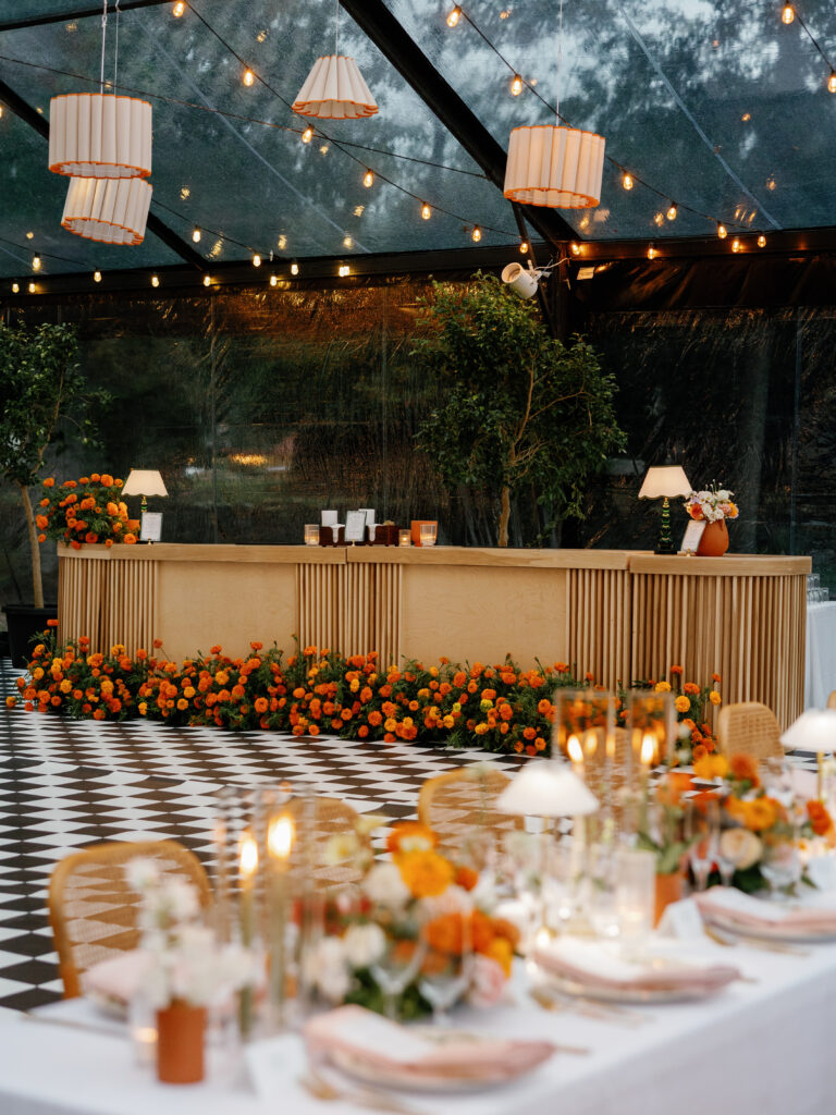goodstone inn wedding, tented wedding, virginia wedding, luxury wedding, luxury wedding planner, orange wedding, outdoor wedding, reception, tented reception, black navitrac tent, wedding reception, orange wedding florals, reception tables, wedding bar, reception bar decor