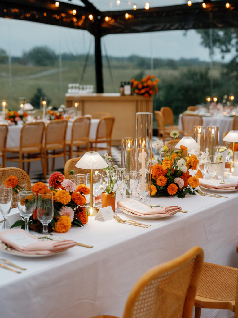 goodstone inn wedding, tented wedding, virginia wedding, luxury wedding, luxury wedding planner, orange wedding, outdoor wedding, reception, tented reception, black navitrac tent, wedding reception, orange wedding florals, reception tables, wedding tablescape