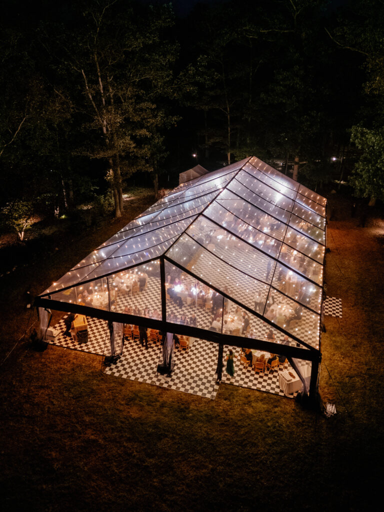 goodstone inn wedding, tented wedding, virginia wedding, luxury wedding, luxury wedding planner, orange wedding, outdoor wedding, reception, tented reception, black navitrac tent, wedding reception, checkered tented floor, tent drone shot