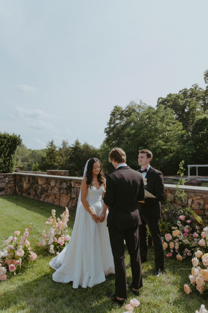 virginia wedding planner, richmond wedding venue, dover hall wedding, outdoor wedding, al fresco wedding, pastel wedding, pastel wedding flowers, outdoor ceremony, ceremony flowers, altar flowers, bride and groom at altar