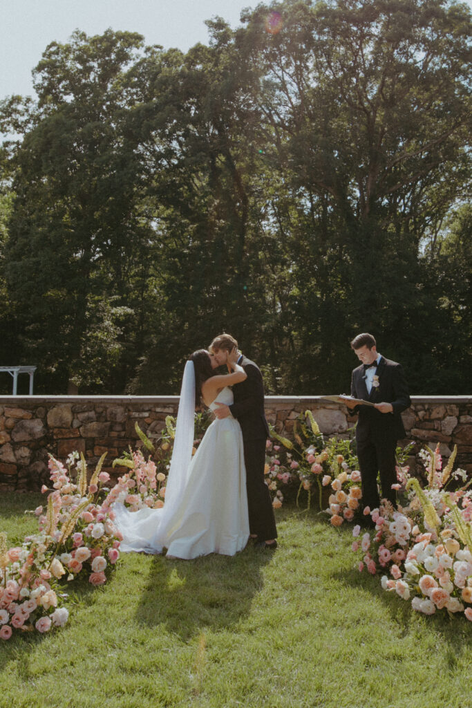 virginia wedding planner, richmond wedding venue, dover hall wedding, outdoor wedding, al fresco wedding, pastel wedding, pastel wedding flowers, outdoor ceremony, ceremony flowers, altar flowers, bride and groom at altar