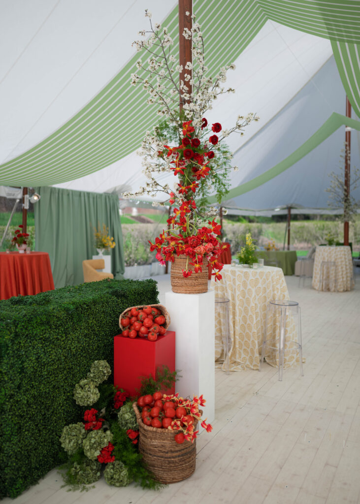 italy inspired wedding, red florals, wedding industry event, green draping, tomatos